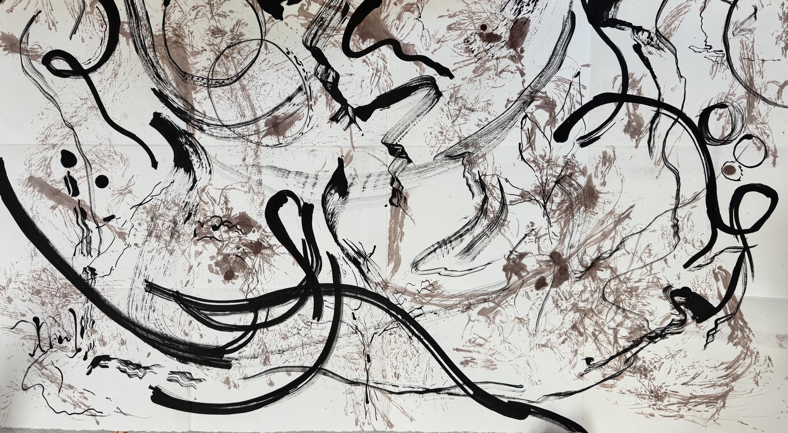 Large black ink and earth pigment abstract work on paper photographed flat